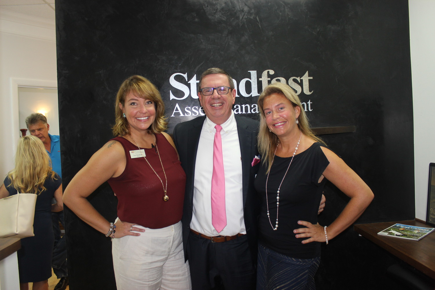 Toni Boudreaux, Scott Grant and Jennifer Price gather at the Chamber “Before Hours” at Standfast Asset Management July 11.
